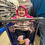 baby, child, shopping_cart, smiling, hoodie, pink, shoes, store, aisle, floor, person, clothing, jeans, hand, metal, baby_shoes, blanket, happy, indoor, retail