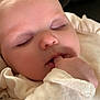 baby, sleeping, finger_in_mouth, cozy, soft, infant, closeup, face, cute, child, clothing, pale_skin, peaceful, indoors, portrait, young, relaxed, expression, head, resting