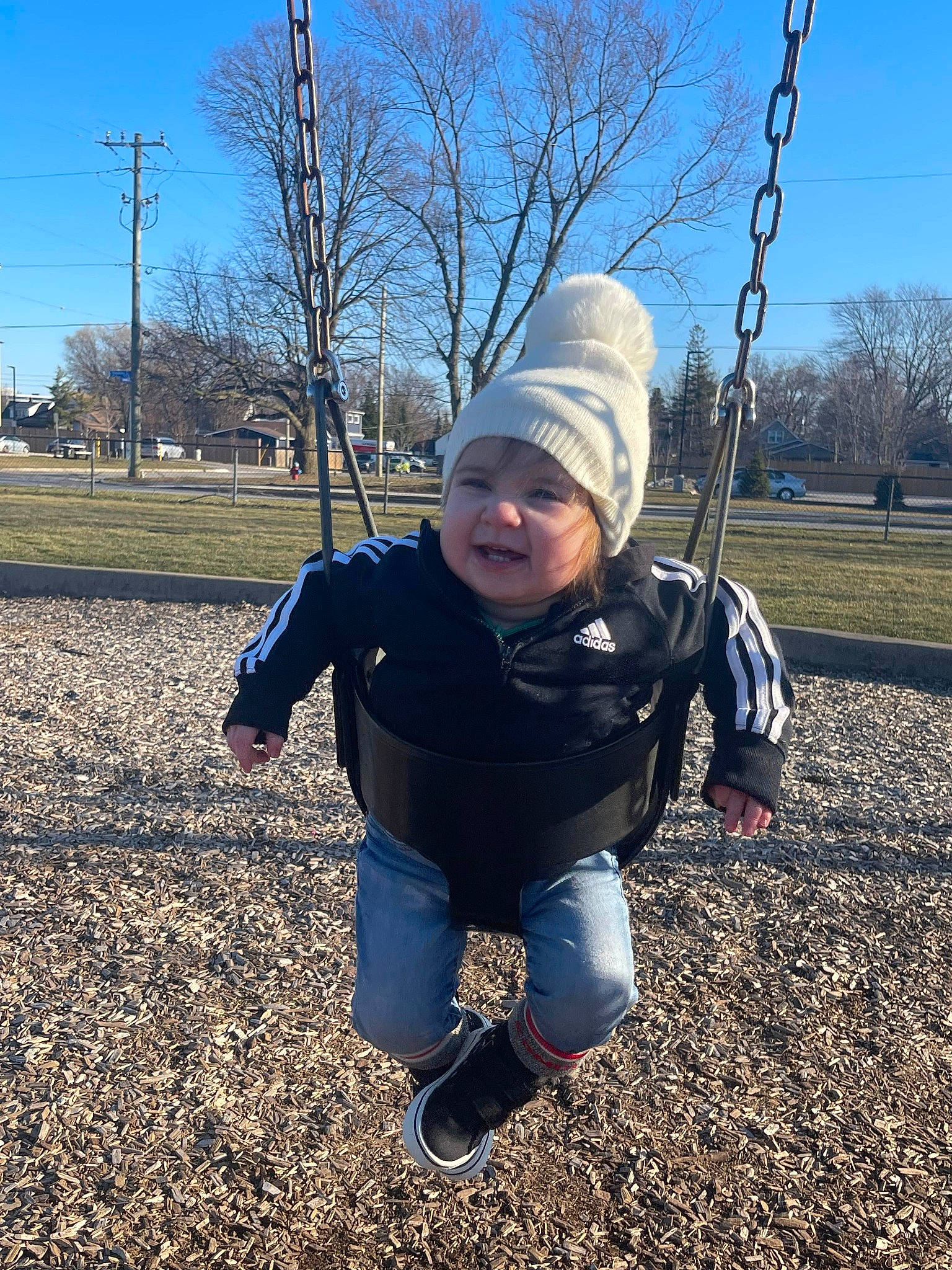 Lyra joined the competition — help win amazing prizes! city, electric_blue, fun, grass, happy, headwear, jacket, landscape, leaf, leisure, outdoor_play_equipment, people_in_nature, person, plant, playground, recreation, sky, smile, soil, swing