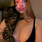 Mio joined the competition — help win amazing prizes! woman, cat, pet, long_hair, piercing, tattoo, black_top, indoor, portrait, face, fur, hand, expression, playful, glowing_dots, light_effect, skin, animal, feline, holding