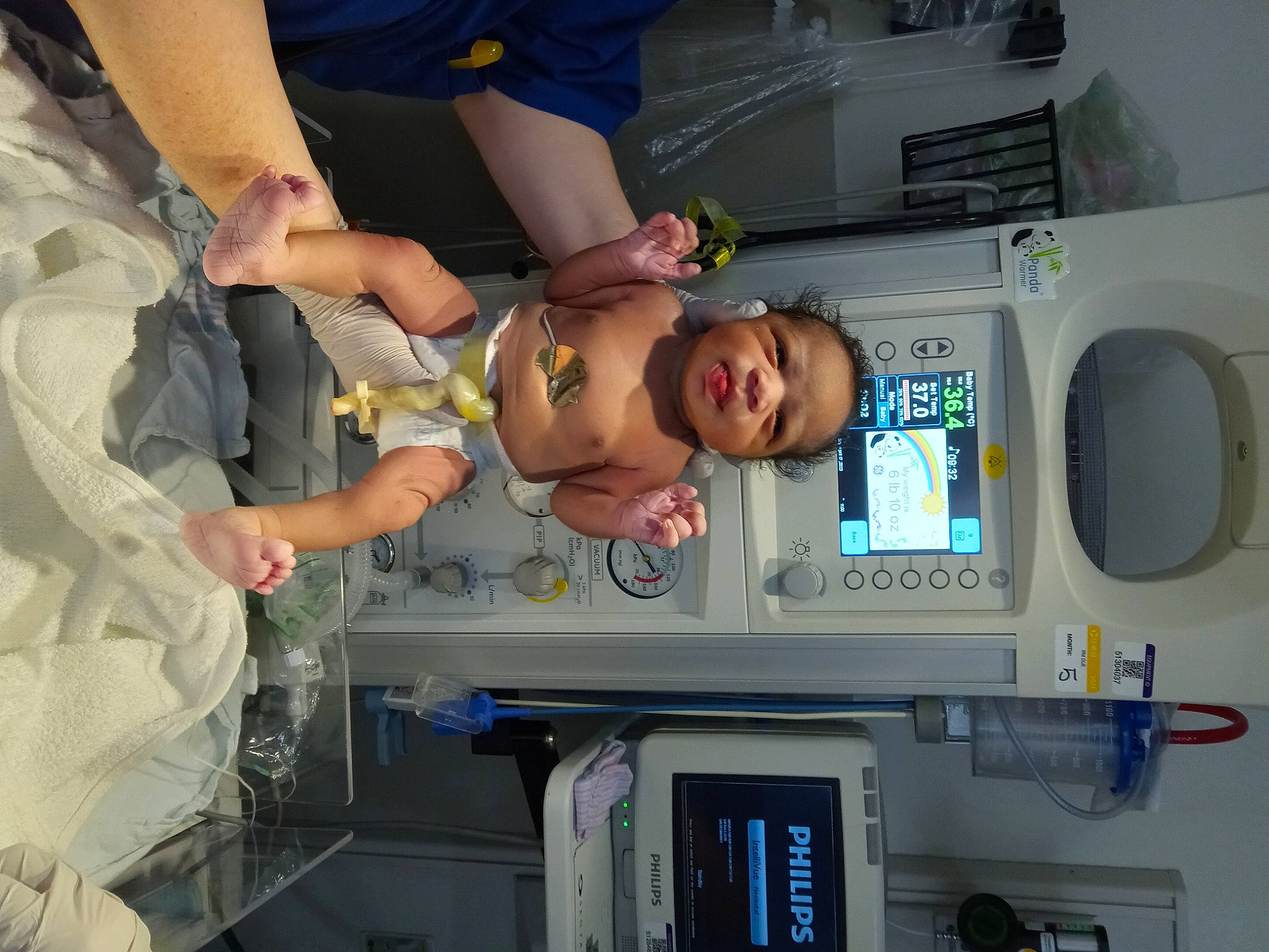 Jahsiah is registered to the contest to win money with this photo: baby, child, event, fun, gesture, hat, machine, person, product, room, service, shorts, smile, t_shirt, toddler