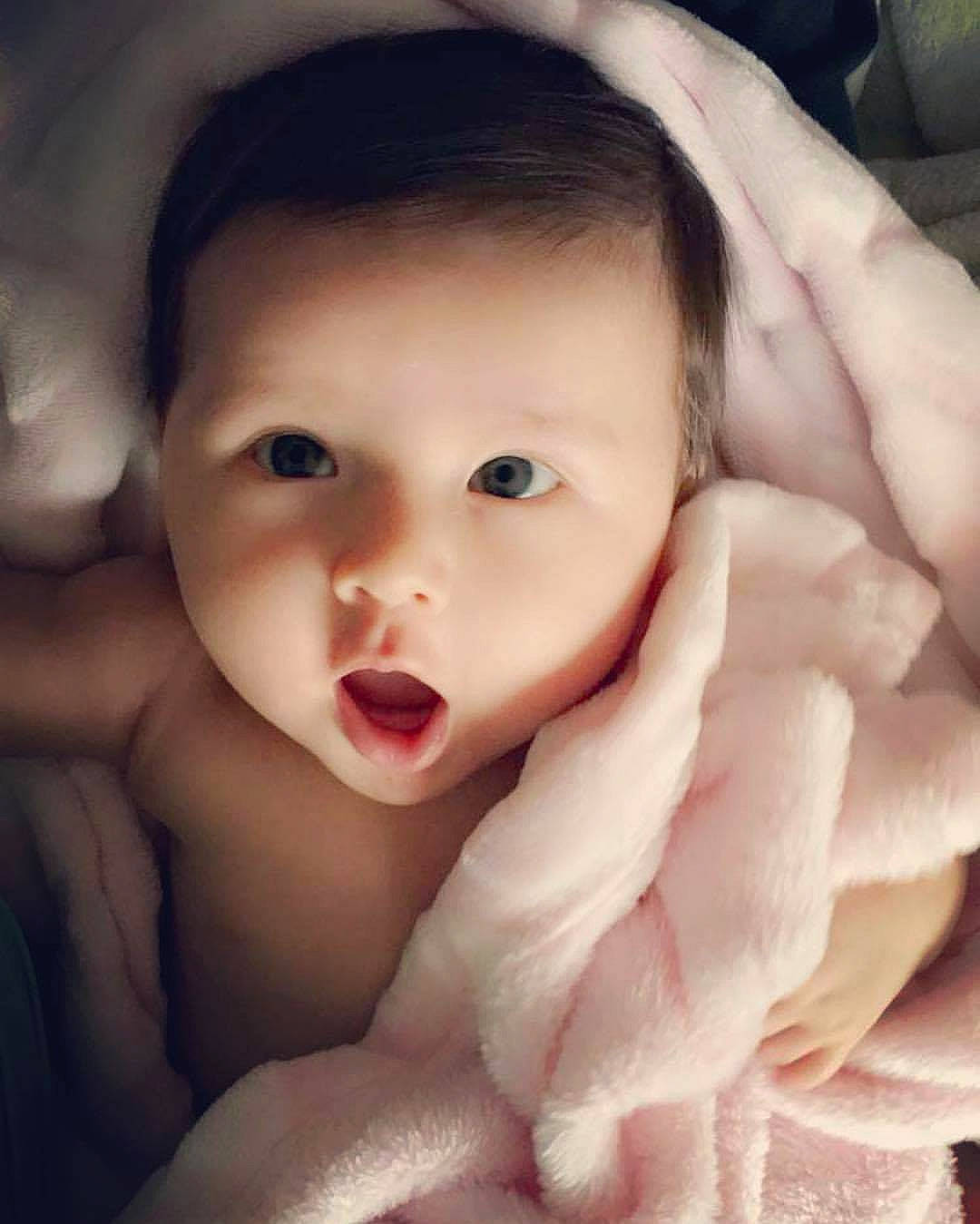 Penelope is registered to the contest to win money with this photo: cheek, child, child_model, chin, face, girl, hand, infant, lip, mouth, person, skin, smile, toddler