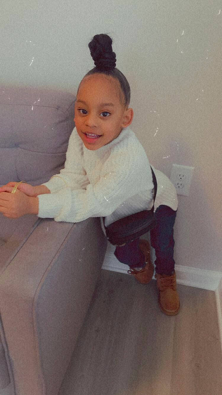 Londynn is registered to the contest to win money with this photo: baby, baby_toddler_clothing, child, floor, flooring, formal_wear, fun, happy, hardwood, human_leg, joy, knee, person, room, shoulder, sitting, sleeve, smile, sock, standing