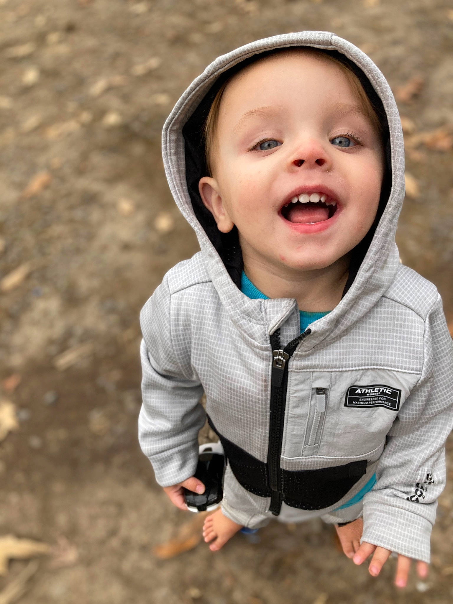 Roman Keen is registered to the contest to win money with this photo: baby, baby_toddler_clothing, child, eye, finger, flash_photography, fun, gesture, grass, happy, outerwear, people_in_nature, person, sitting, skin, sleeve, smile, soil, t_shirt, toddler