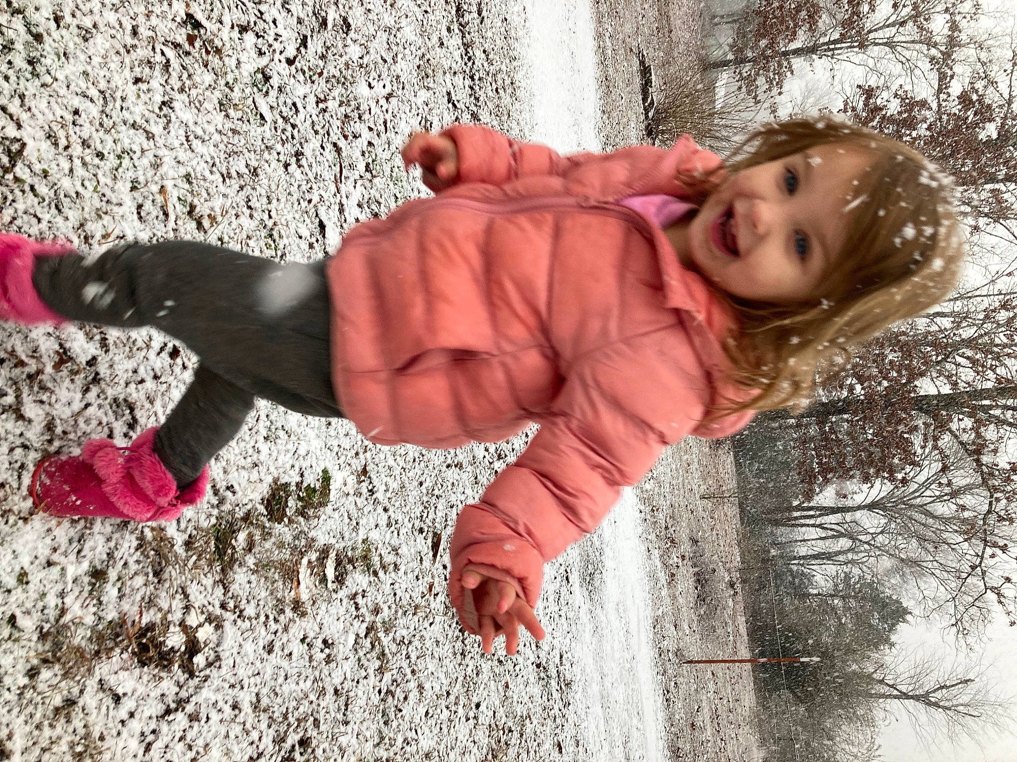 Cheyenne is registered to the contest to win money with this photo: child, freezing, fun, fur, grass, happy, human_leg, jacket, joy, leisure, pattern, people_in_nature, person, plant, shadow, sitting, smile, soil, toddler, tree