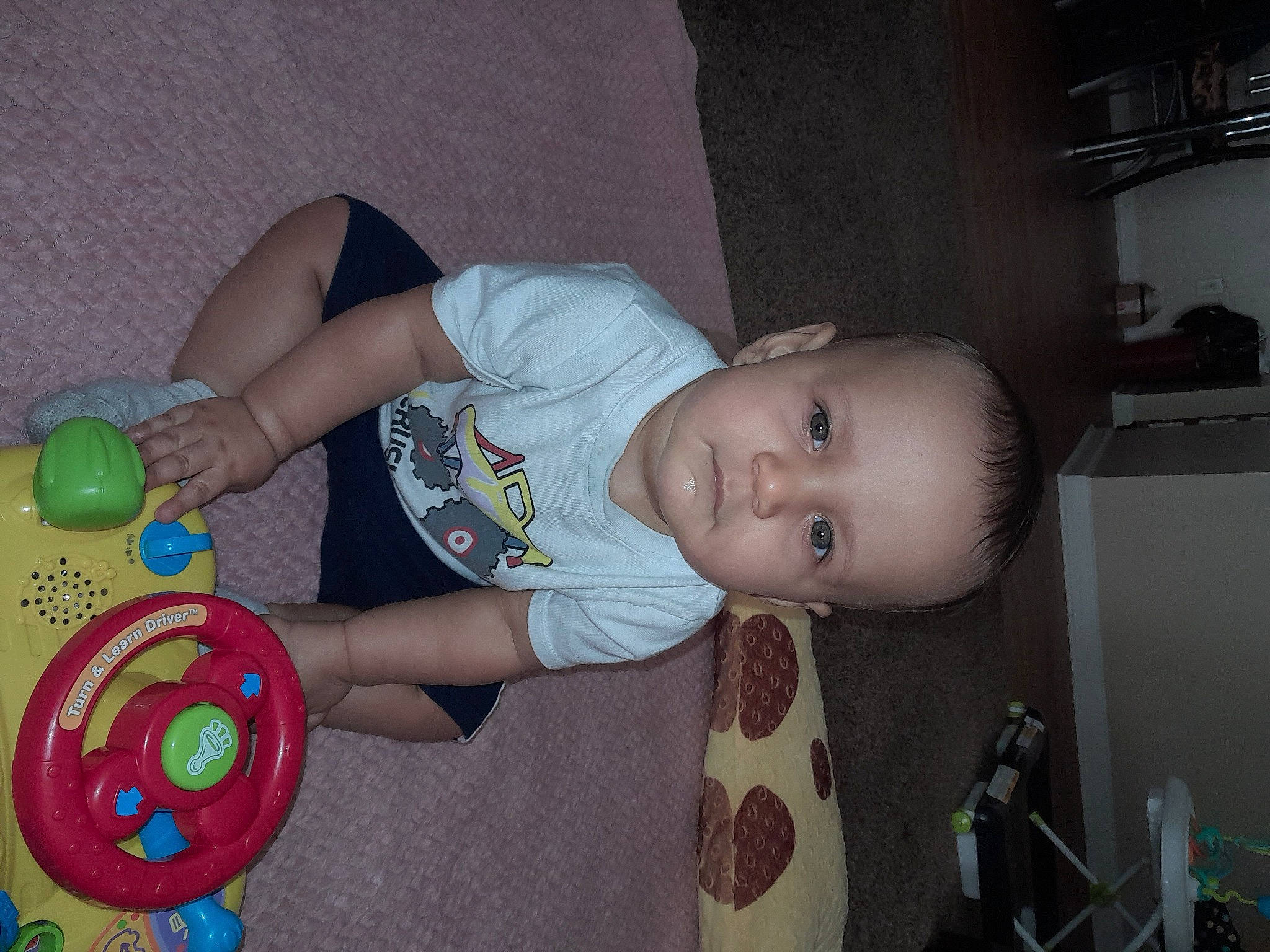 Dallas joined the competition — help win amazing prizes! baby, baby_playing_with_toys, baby_products, baby_toddler_clothing, baby_toys, child, flooring, fun, person, room, shelf, sitting, smile, toddler, toy