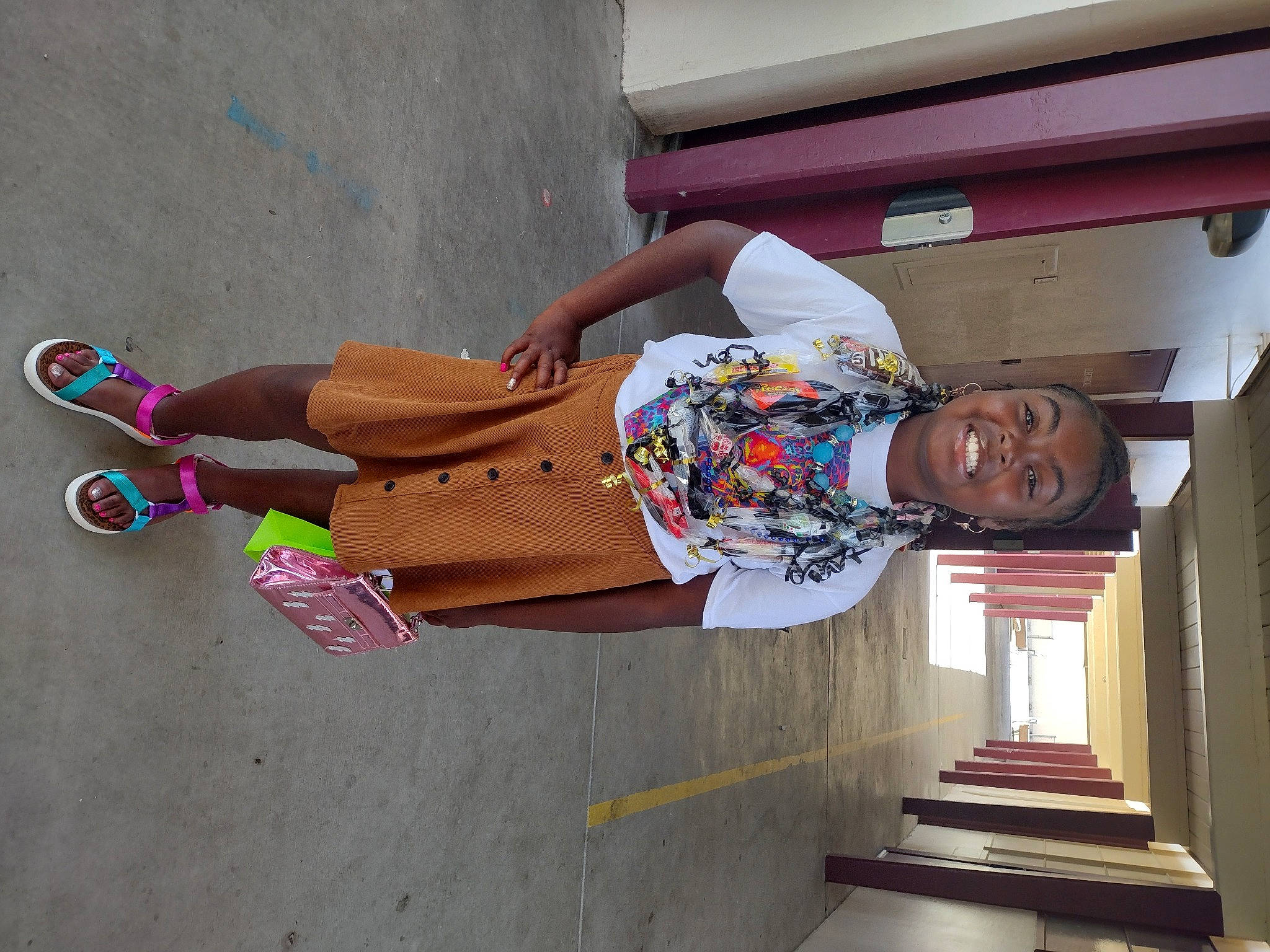 Bria is registered to the contest to win money with this photo: art, concrete, facade, fun, human_leg, joy, leisure, machine, mural, person, recreation, sandal, sidewalk, smile, stairs, thigh, tire, visual_arts, wood