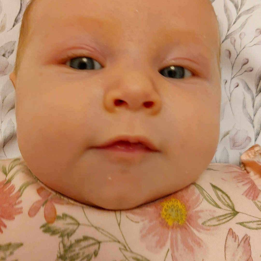 Alice Rose is registered to the contest to win money with this photo: baby, bed, blanket, bodypart, bonnet, clothing, crib, cushion, face, finger, furniture, hand, hat, head, homedecor, infantbed, linen, mouth, newborn, pattern