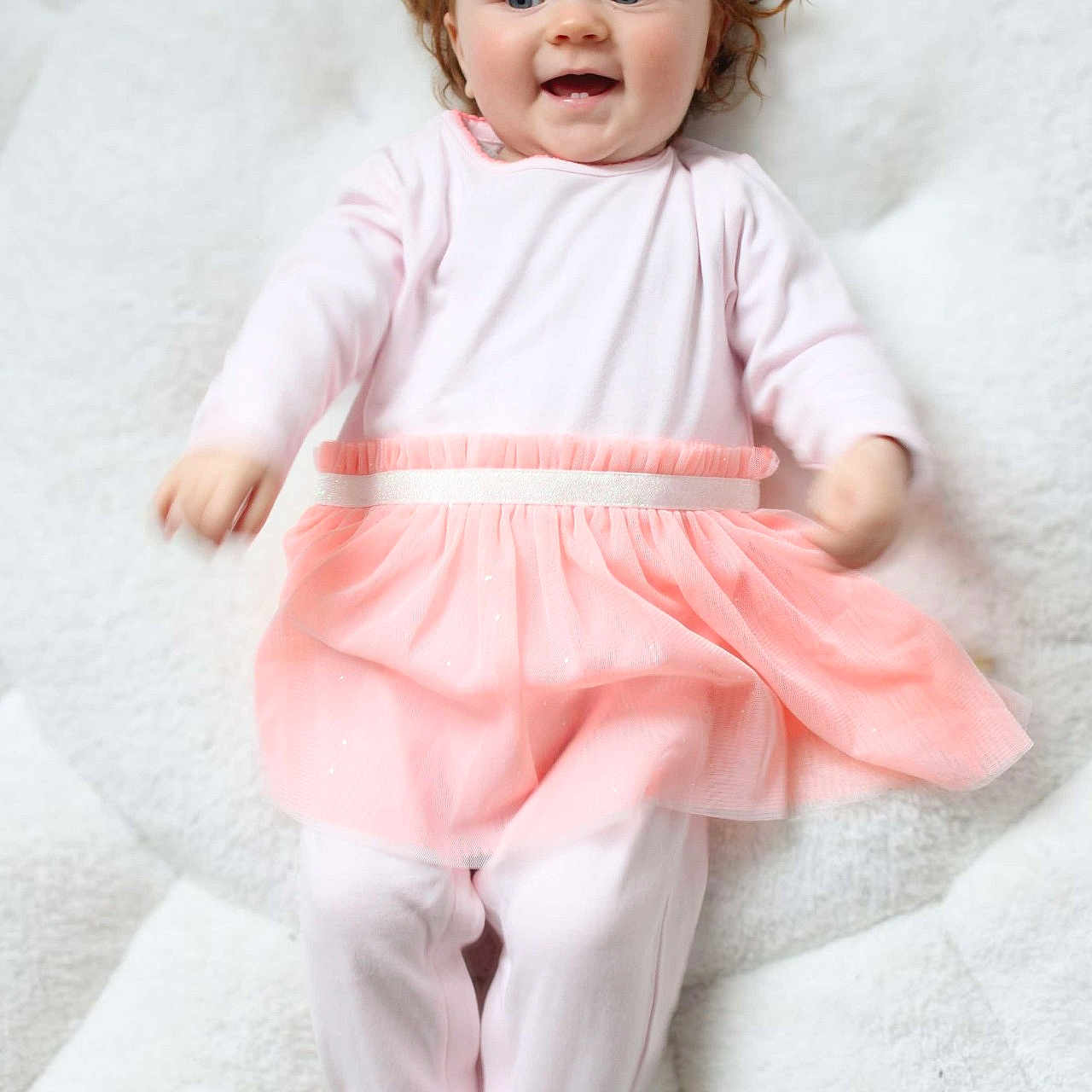 Leïly participe au concours pour gagner de l'argent avec cette photo : baby, bodypart, clothing, doll, dress, face, finger, formalwear, hand, head, newborn, pajamas, pants, person, photography, portrait, sitting, sleeve, standing, toy