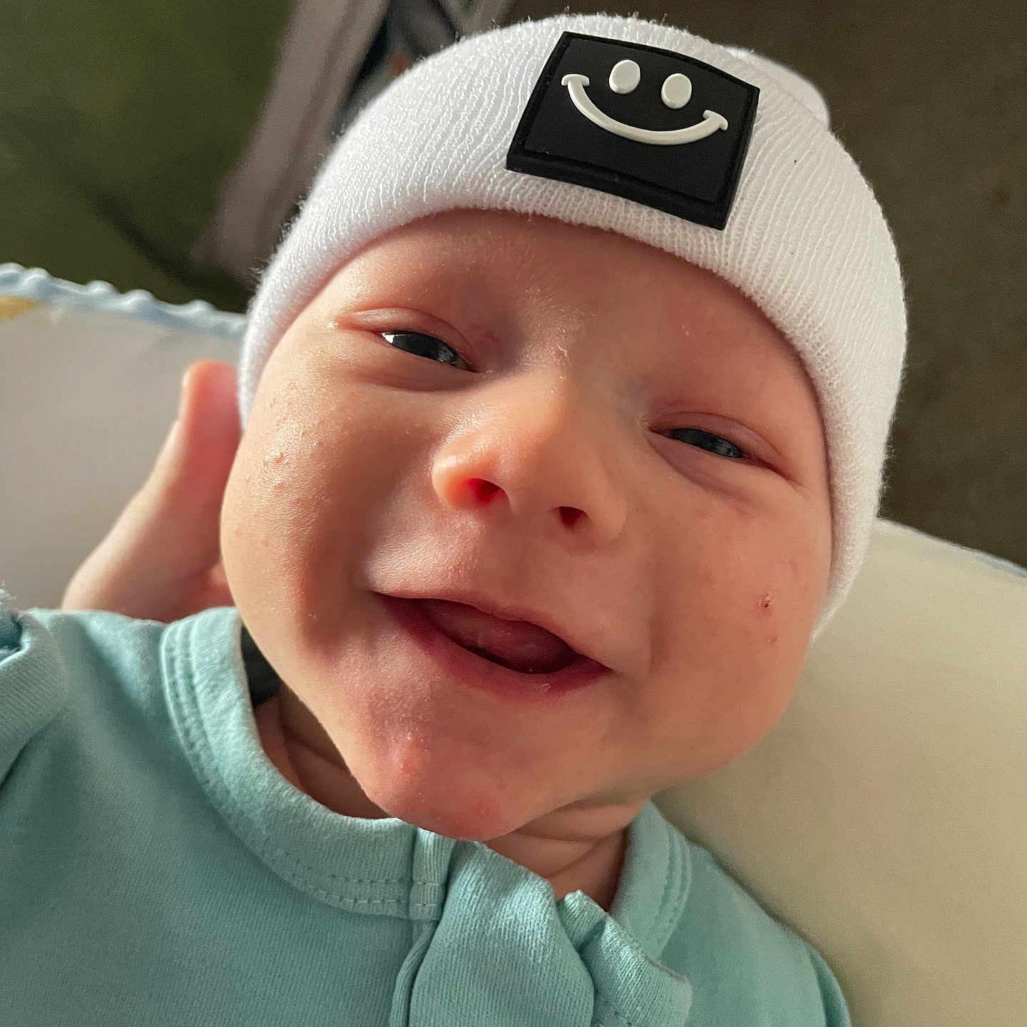 Grayson joined the competition — help win amazing prizes! baby, beanie, bonnet, cap, clothing, face, happy, hat, head, newborn, person, photography, portrait, smile