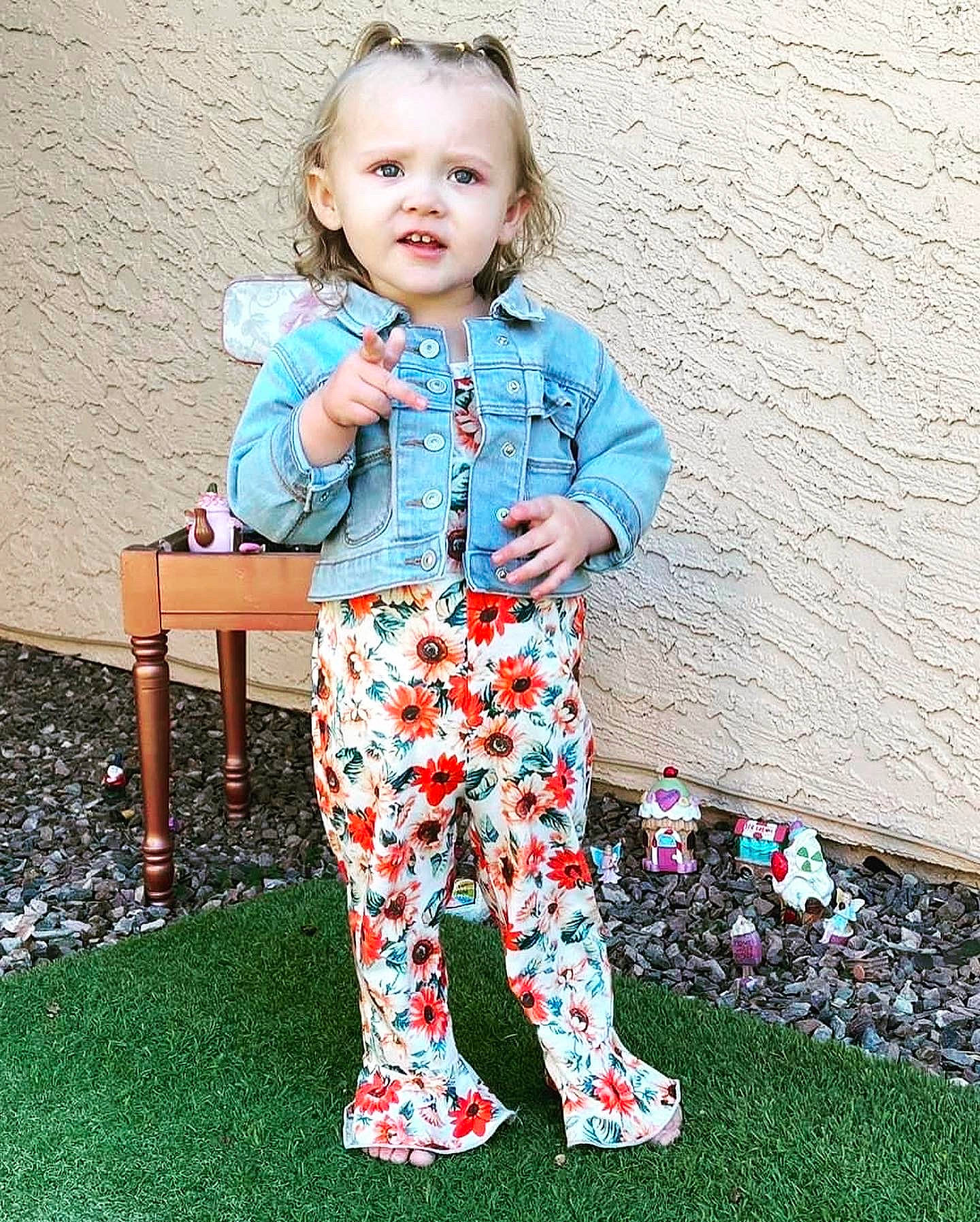 Zeynah joined the competition — help win amazing prizes! baby_toddler_clothing, child, collar, electric_blue, face, fashion_design, fun, grass, happy, magenta, pattern, people_in_nature, person, play, portrait_photography, sitting, sleeve, smile, t_shirt, toddler