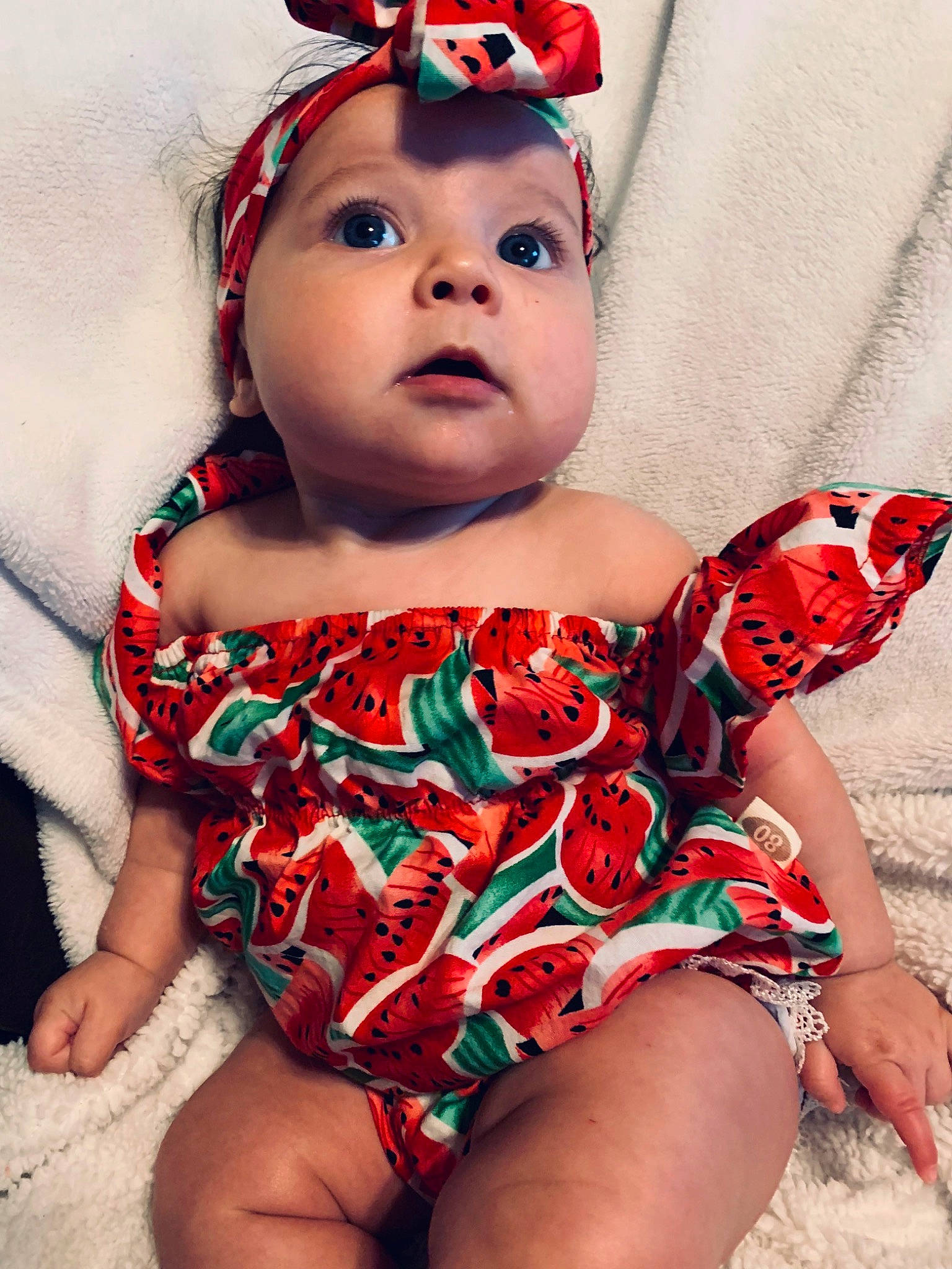 Amanda is registered to the contest to win money with this photo: baby, baby_bloomers, baby_products, baby_toddler_clothing, cheek, child, child_model, design, face, hair_accessory, head, headgear, leg, lip, mouth, nose, person, product, red, smile