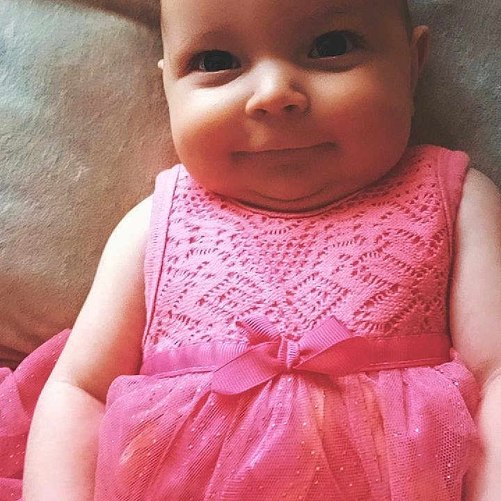 Gracelynn joined the competition — help win amazing prizes! baby, baby_girl, camera_interface, child, chubby_cheeks, closeup, cute, eyes, fabric, face, happy, head, indoors, infant, person, pink_dress, portrait, skin, sleeveless, smiling