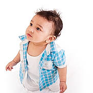 Dabur joined the competition — help win amazing prizes! baby, child, infant, blue_shirt, white_outfit, curious, standing, portrait, studio, isolated, cute, looking_up, short_hair, small_hands, innocence, expression, clothing, baby_boy, casual_wear, white_background
