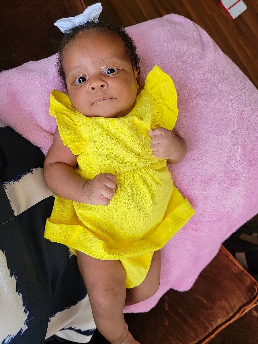 Madison joined the competition — help win amazing prizes! arm, baby, baby_products, baby_toddler_clothing, cheek, child, comfort, eye, gesture, hand, happy, human_leg, iris, magenta, neck, person, pink, purple, skin, sleeve