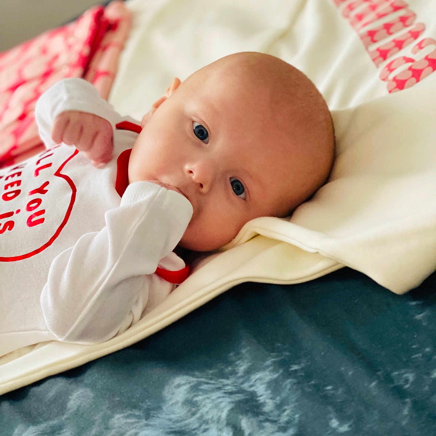 Carson joined the competition — help win amazing prizes! baby, bed, biting, blanket, crib, face, furniture, happy, head, infantbed, newborn, person, photography, portrait, smile, yawning