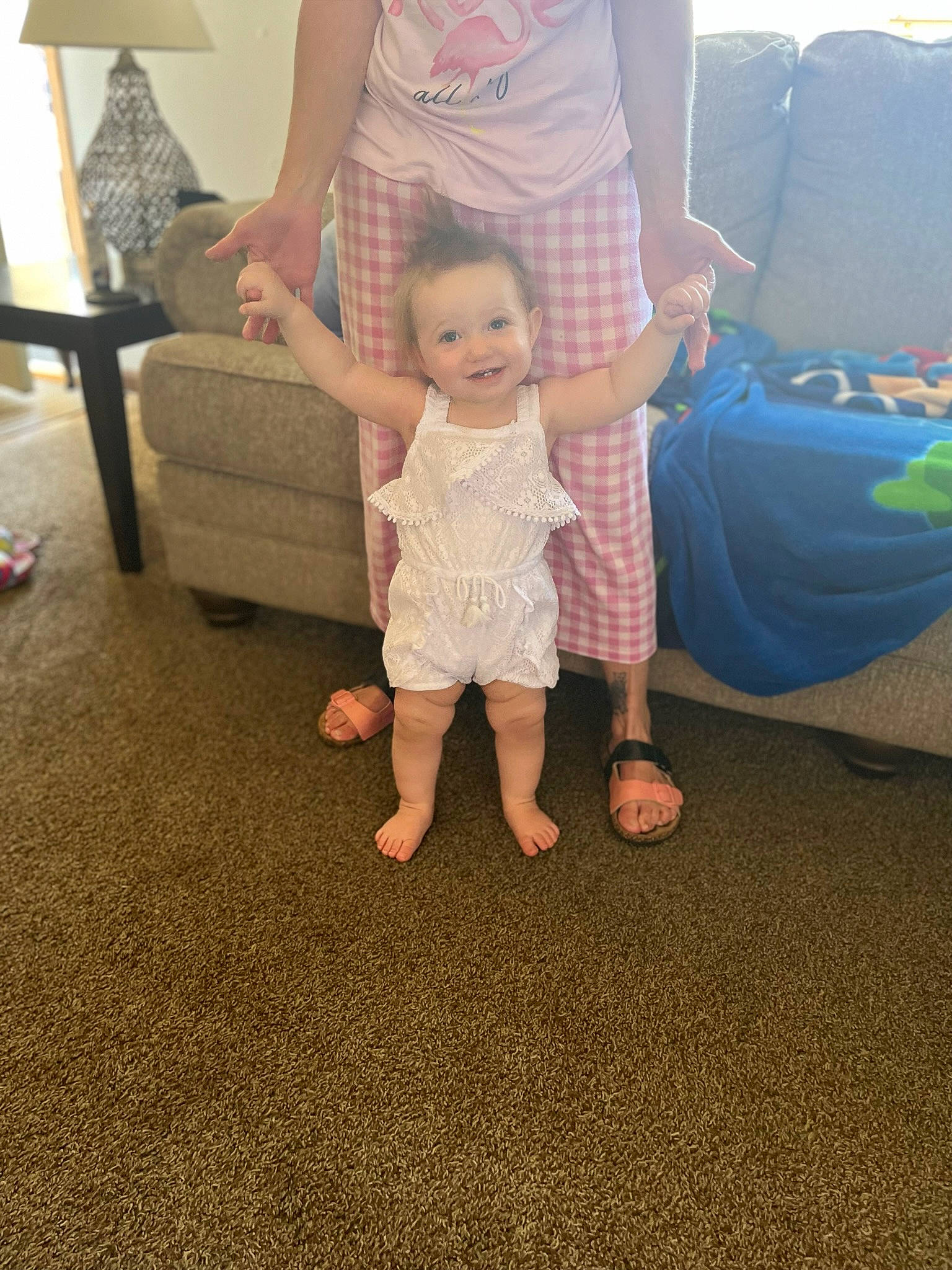 Novaleigh is registered to the contest to win money with this photo: baby, baby_toddler_clothing, child, comfort, flooring, foot, fun, furniture, gesture, hand, happy, human_leg, joint, joy, leg, living_room, person, sitting, t_shirt, thumb
