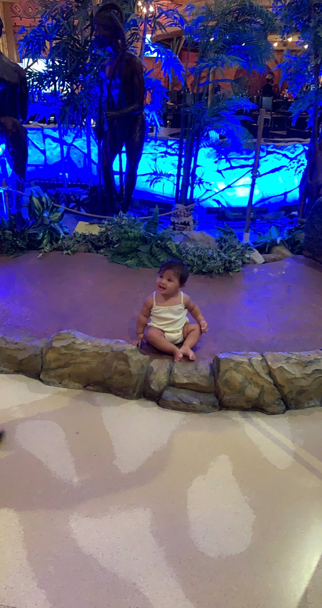 Analia joined the competition — help win amazing prizes! darkness, electric_blue, entertainment, event, flooring, fun, landscape, leisure, midnight, night, performance_art, performing_arts, person, recreation, reflection, sandal, sitting, toddler, tourism, vacation