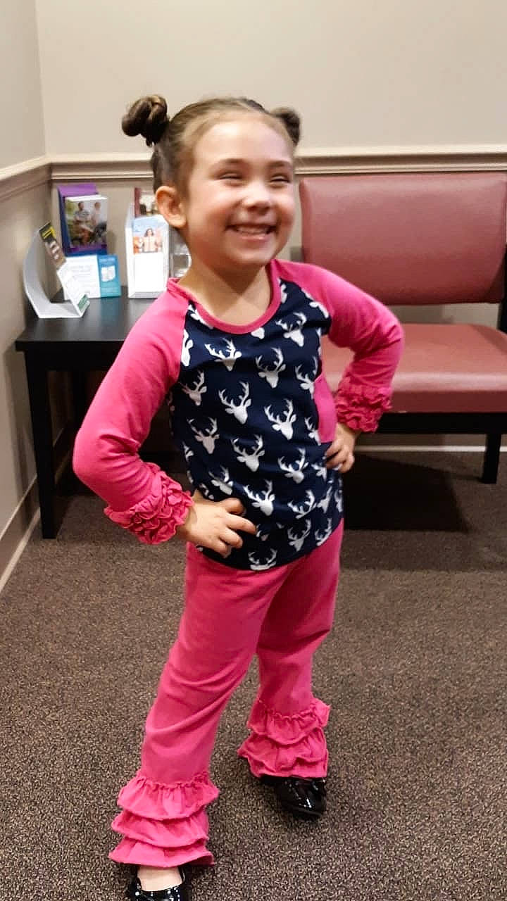 Sara Jane is registered to the contest to win money with this photo: child, child_model, clothing, footwear, joy, magenta, outerwear, pajamas, pattern, person, pink, play, shoe, shoulder, sleeve, smile, sportswear, standing, t_shirt, toddler