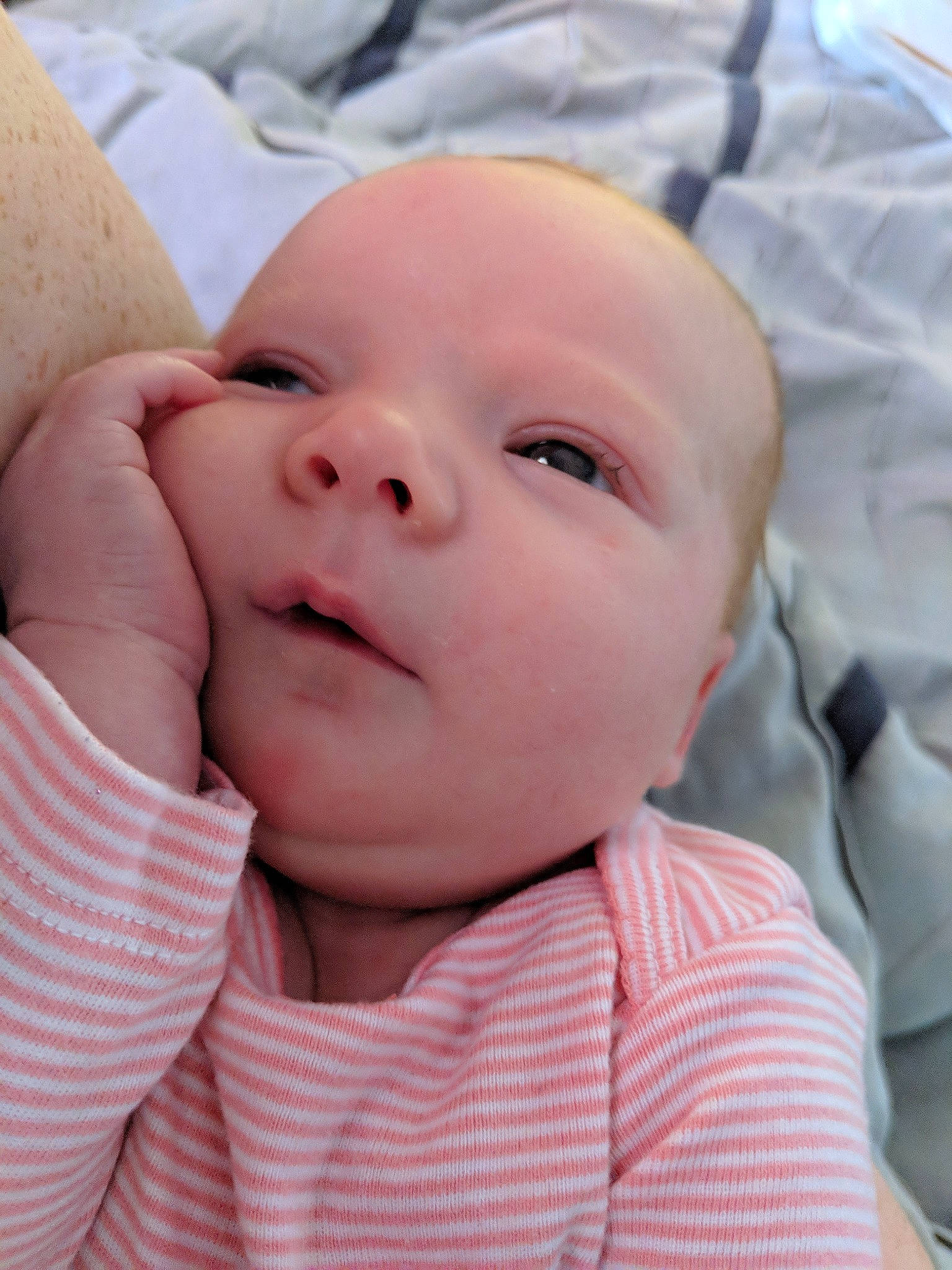 Paisley Mae is registered to the contest to win money with this photo: cheek, child, close_up, ear, eye, face, forehead, girl, hand, head, infant, lip, mouth, nose, person, pink, skin, smile, toddler