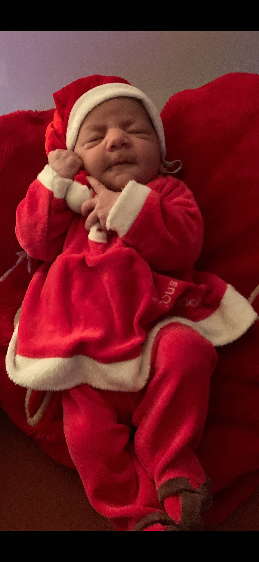 Razane participe au concours pour gagner de l'argent avec cette photo : baby, baby_sleeping, baby_toddler_clothing, cheek, child, comfort, face, finger, happy, headwear, linens, lip, magenta, mouth, person, pink, red, skin, sleeve, thumb