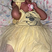 Angel joined the competition — help win amazing prizes! baby, sleeping, pacifier, yellow_dress, headband, blanket, butterfly_pattern, infant, cute, tutu, newborn, foot, hand, soft_lighting, indoors, resting, child, portrait, peaceful, closeup