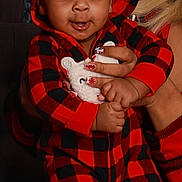 Kasai joined the competition — help win amazing prizes! baby, child, red_pajamas, hoodie, plush_toy, hand, person, indoor, window, pattern, matching_outfits, smile, cute, cozy, holding, socks, adult, face, portrait, warm_lighting