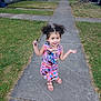bodypart, child, clothing, dress, face, female, finger, flagstone, footwear, girl, grass, hand, head, path, person, photography, plant, portrait, sidewalk, walkway