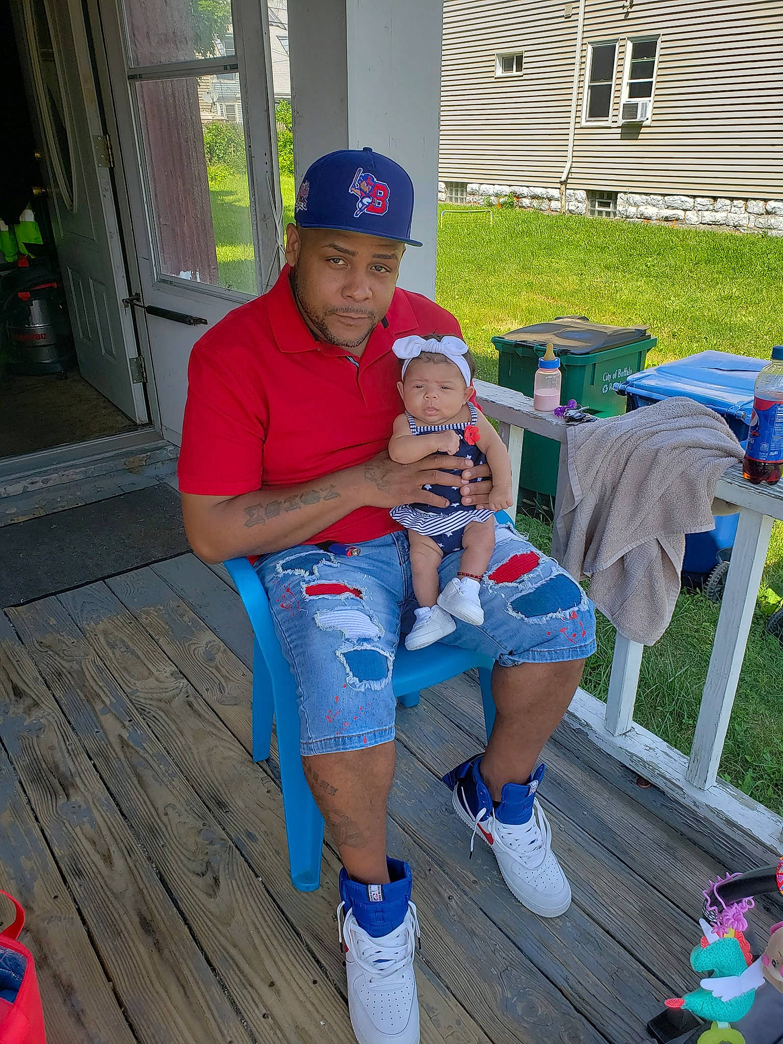 Annalise is registered to the contest to win money with this photo: baseball_cap, boot, cap, electric_blue, event, flooring, fun, hat, headwear, human_leg, lap, leg, leisure, person, recreation, sandal, shorts, sitting, sneakers, t_shirt