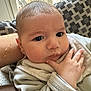 Charles participe au concours pour gagner de l'argent avec cette photo : baby, infant, face, hand, towel, clothing, couch, cushion, window, dog, indoor, person, portrait, skin, expression, curious, resting, soft, cozy, home