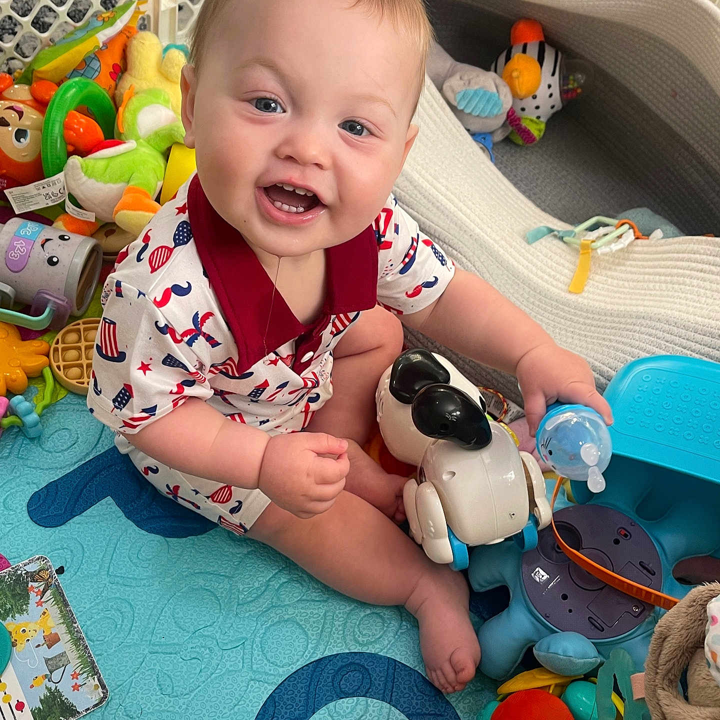 River joined the competition — help win amazing prizes! baby, ball, cushion, face, football, furniture, happy, head, homedecor, laughing, person, photography, playarea, portrait, sitting, smile, soccer, soccerball, sport, toy