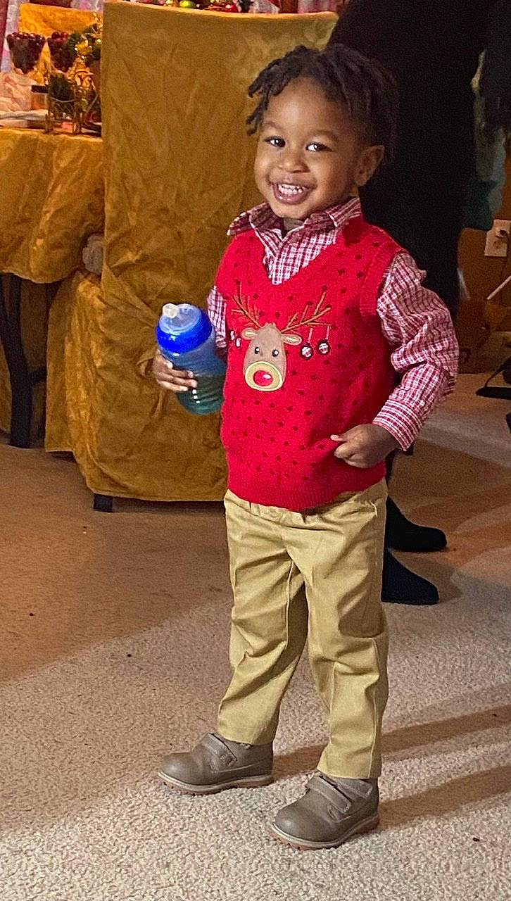 Jamir joined the competition — help win amazing prizes! bag, child, clothing, face, facial_expression, fun, hair, hairstyle, happy, head, human, joy, leisure, luggage_and_bags, person, skin, sleeve, smile, standing, t_shirt