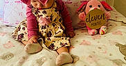 Janelis joined the competition — help win amazing prizes! baby, child, infant, pink_headband, floral_dress, plush_toy, blanket, pillow, bed, soft_toys, cute, indoors, sitting, patterned_blanket, decor, toddler, cozy, pink, young_child, sleepwear