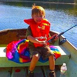 Brody joined the competition — help win amazing prizes! boat, boats_and_boating_equipment_and_supplies, bottle, fun, happy, joy, lake, leisure, oar, person, personal_protective_equipment, recreation, shorts, skiff, smile, t_shirt, toddler, vehicle, water, water_bottle