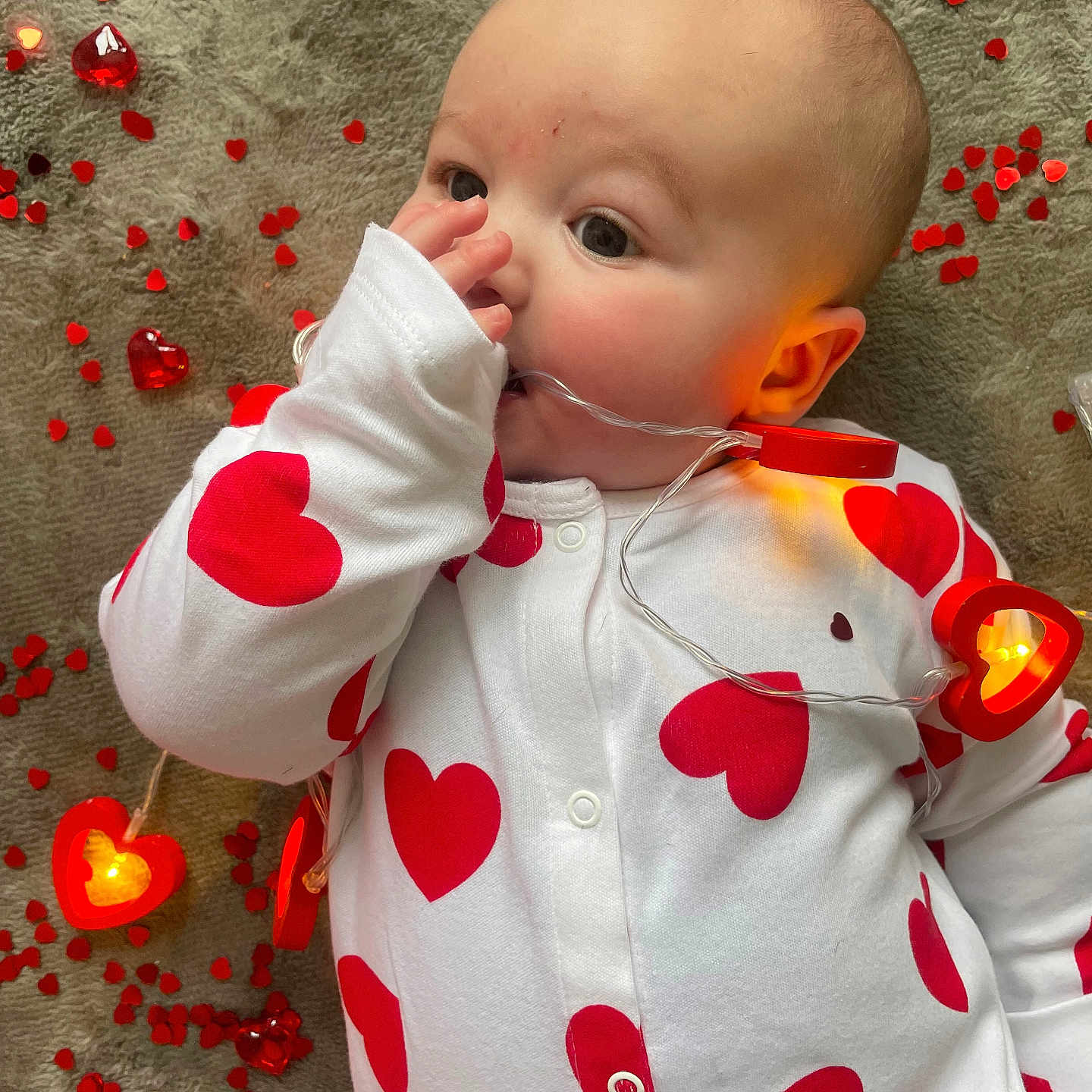 Vinnie joined the competition — help win amazing prizes! baby, balloon, biting, bodypart, clothing, coat, cutlery, face, finger, flower, hand, head, jacket, lighting, person, petal, photography, plant, portrait, spoon