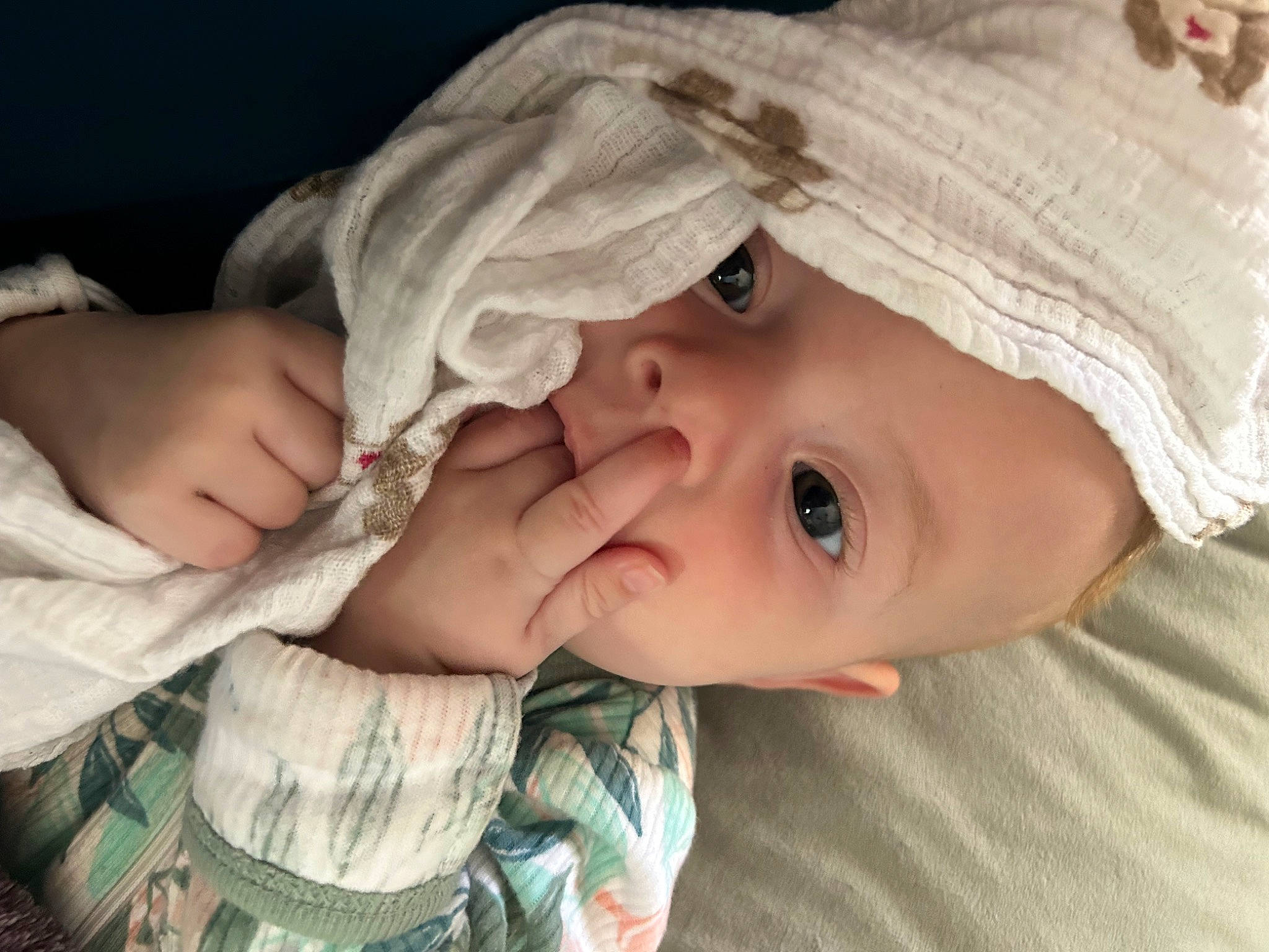 Josephine is registered to the contest to win money with this photo: baby, baby_products, baby_toddler_clothing, cheek, child, comfort, eyelash, fashion_accessory, gesture, grass, happy, hat, iris, lip, mouth, nose, person, portrait_photography, skin, toddler