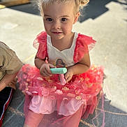 Josie joined the competition — help win amazing prizes! child, toddler, girl, chalk, sidewalk, dress, pink, pigtails, flowers, sunlight, outdoor, play, smile, sitting, curious, casual, daylight, person, cute, happy