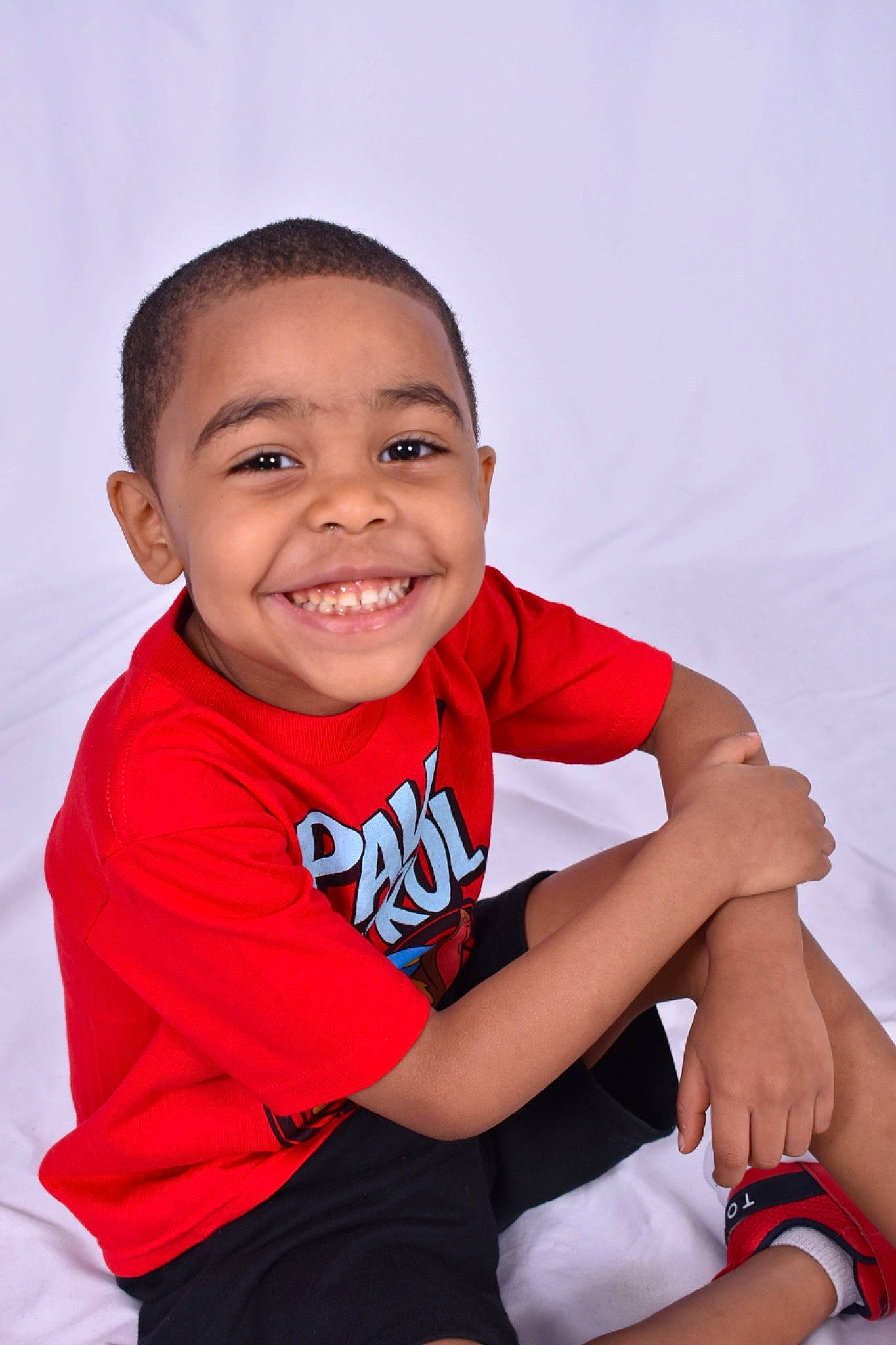 Aaden is registered to the contest to win money with this photo: arm, baby_toddler_clothing, comfort, elbow, finger, flash_photography, gesture, hand, happy, human_body, joint, joy, knee, leg, neck, person, shorts, skin, sleeve, smile