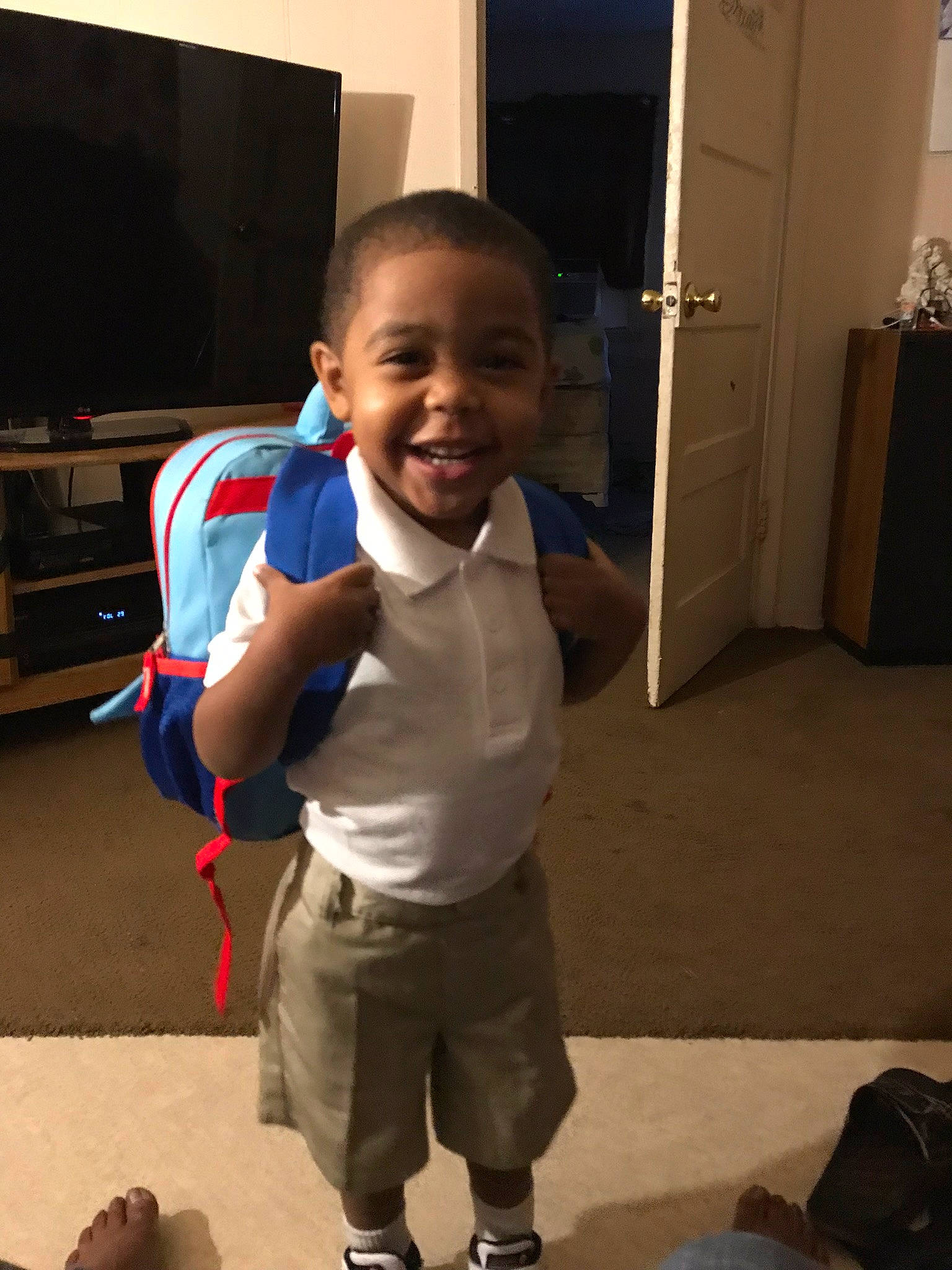 Aaden is registered to the contest to win money with this photo: chin, cool, door, electric_blue, face, finger, floor, flooring, fun, happy, head, human_body, joint, joy, nose, person, shorts, shoulder, smile, thumb