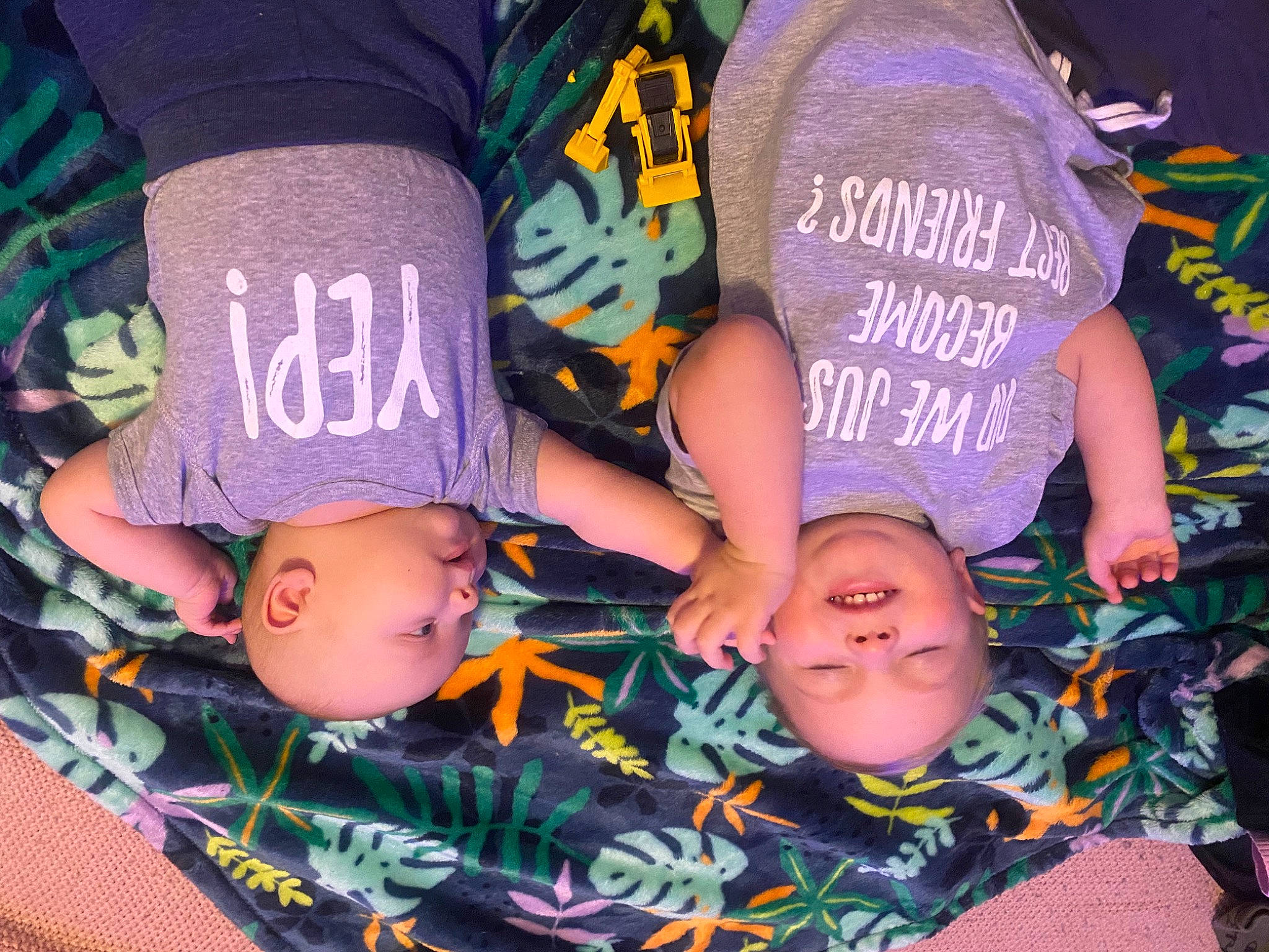 Xavier is registered to the contest to win money with this photo: child, cool, event, finger, font, friendship, fun, happy, hat, headgear, human_leg, interaction, leisure, mouth, nail, person, purple, t_shirt, thigh, tree