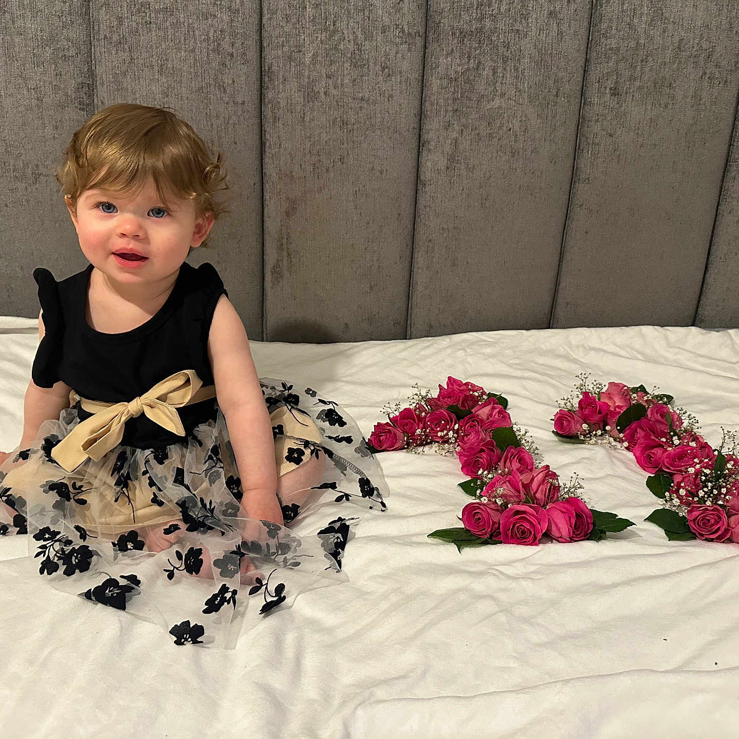 Katie joined the competition — help win amazing prizes! baby, bed, bodypart, clothing, dress, face, finger, flower, flowerarrangement, flowerbouquet, furniture, hand, head, pattern, person, petal, photography, plant, portrait, rose