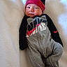 Jaxon joined the competition — help win amazing prizes! baby, infant, blanket, clothing, sportswear, nike, hat, beanie, face, person, portrait, lying_down, cute, indoors, sleepwear, child, expression, warm, soft, cozy
