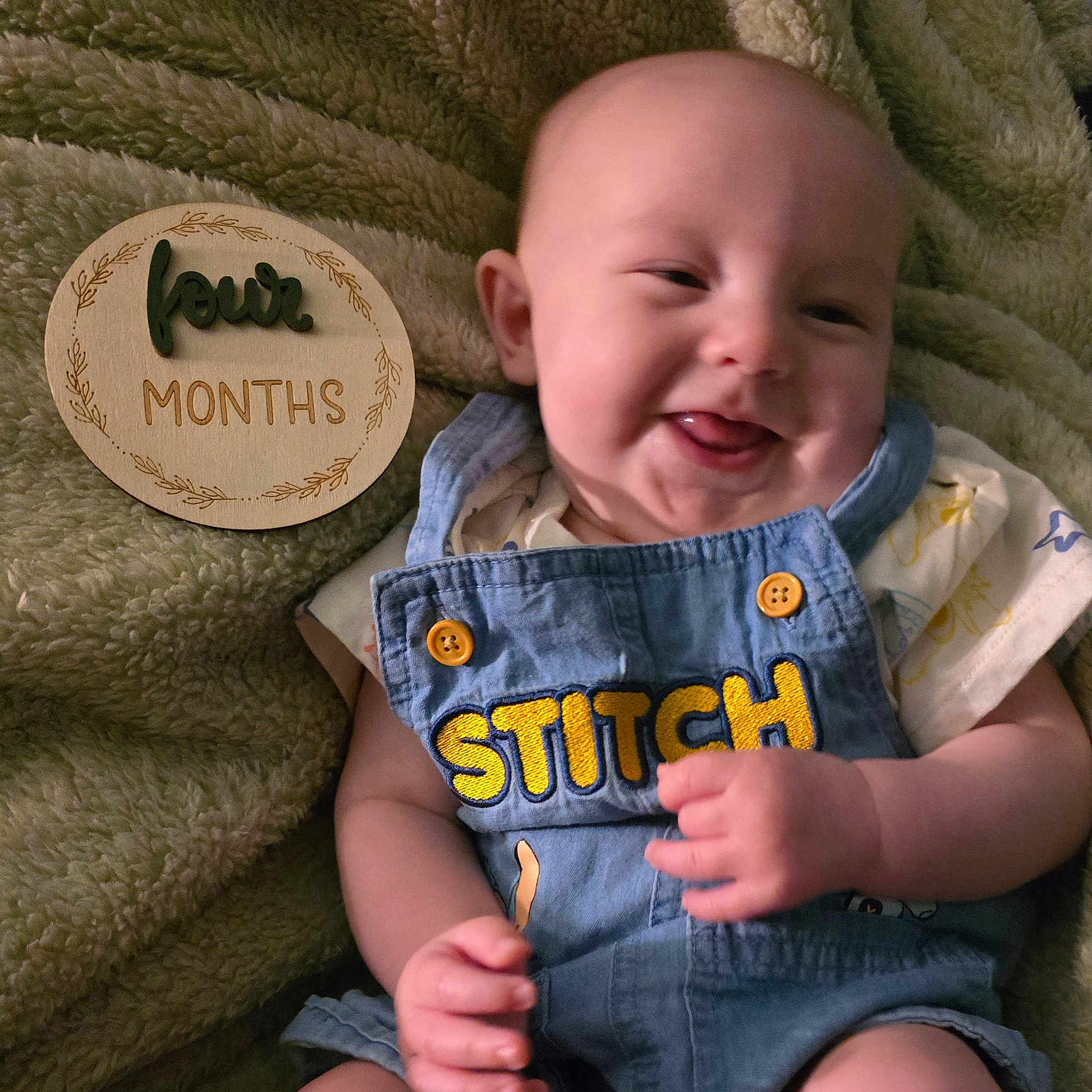 Coulter joined the competition — help win amazing prizes! baby, baby_boy, baby_girl, blanket, child, clothing, cute, denim, face, four_months, hand, happy, infant, milestone, overall, person, plaque, portrait, skin, smiling