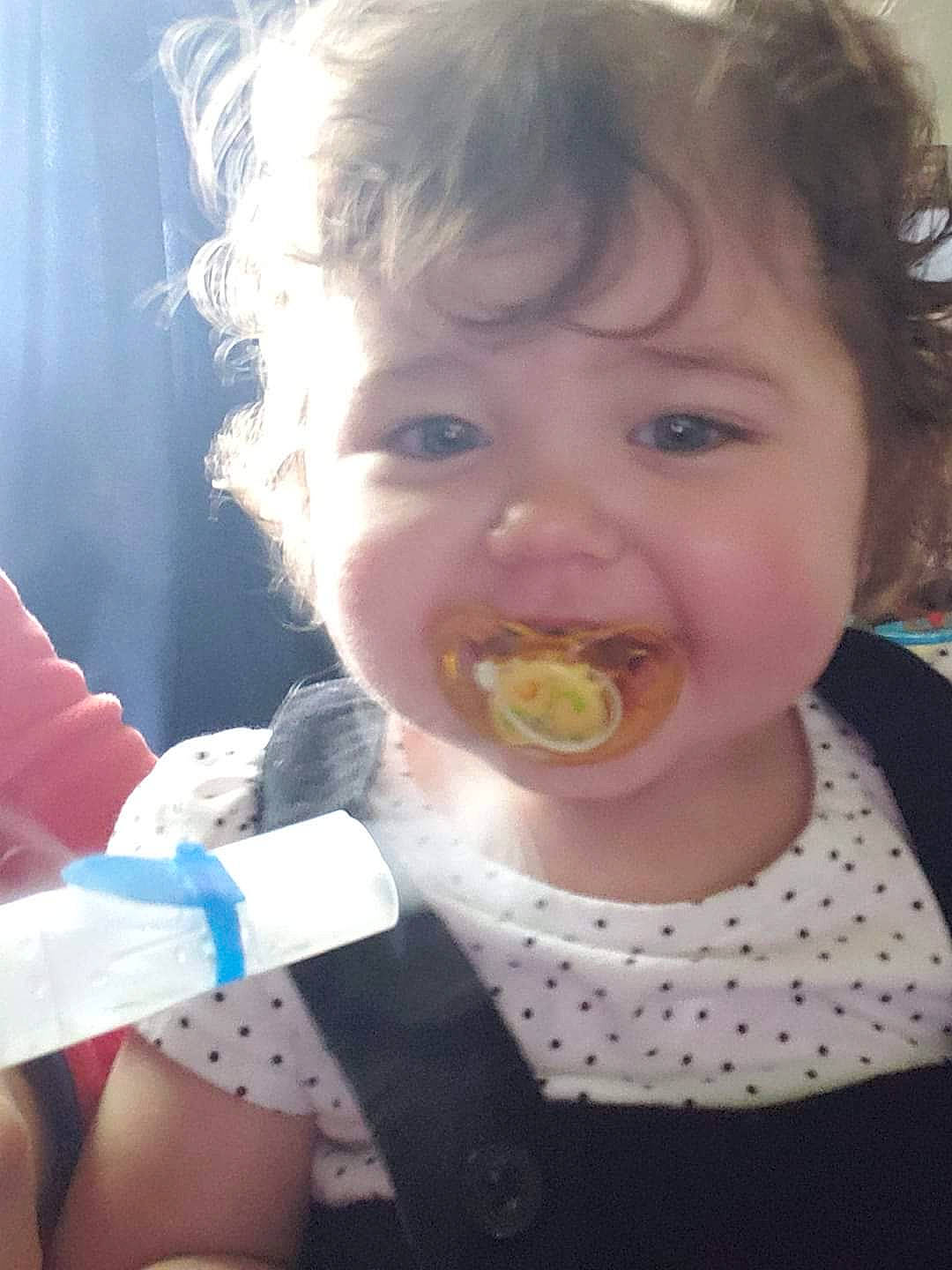 Ellie Mae is registered to the contest to win money with this photo: baby, baby_food, child, eating, food, fun, mouth, nose, person, smile, toddler
