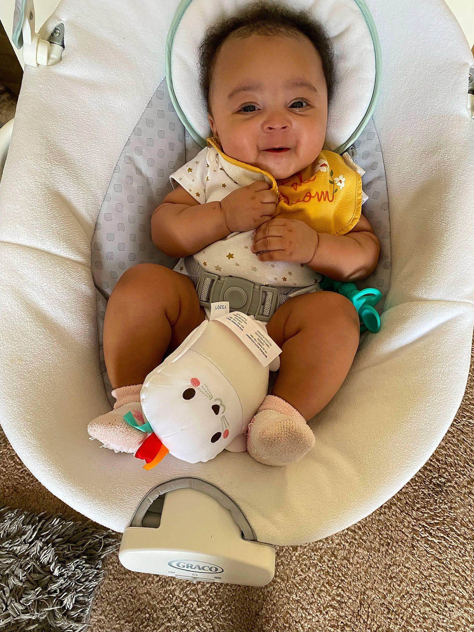 Journey is registered to the contest to win money with this photo: abdomen, baby, baby_products, baby_safety, baby_sleeping, baby_toddler_clothing, chair, cheek, child, comfort, foot, happy, linens, person, room, sitting, smile, sock, stuffed_toy, toddler