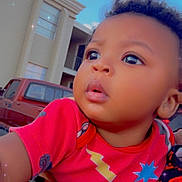 Obsidian is registered to the contest to win money with this photo: baby, blue_sky, building, car, child, clothing, curious, cute, daylight, expression, face, hand, holding, outdoor, person, portrait, red_shirt, short_hair, skin, sparkles