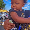 Obsidian is registered to the contest to win money with this photo: baby, black_shirt, car, checkered_pants, child, clothing, cloud, curly_hair, daylight, expression, hand, holding, outdoor, parking_lot, person, portrait, sky, street, toddler, urban