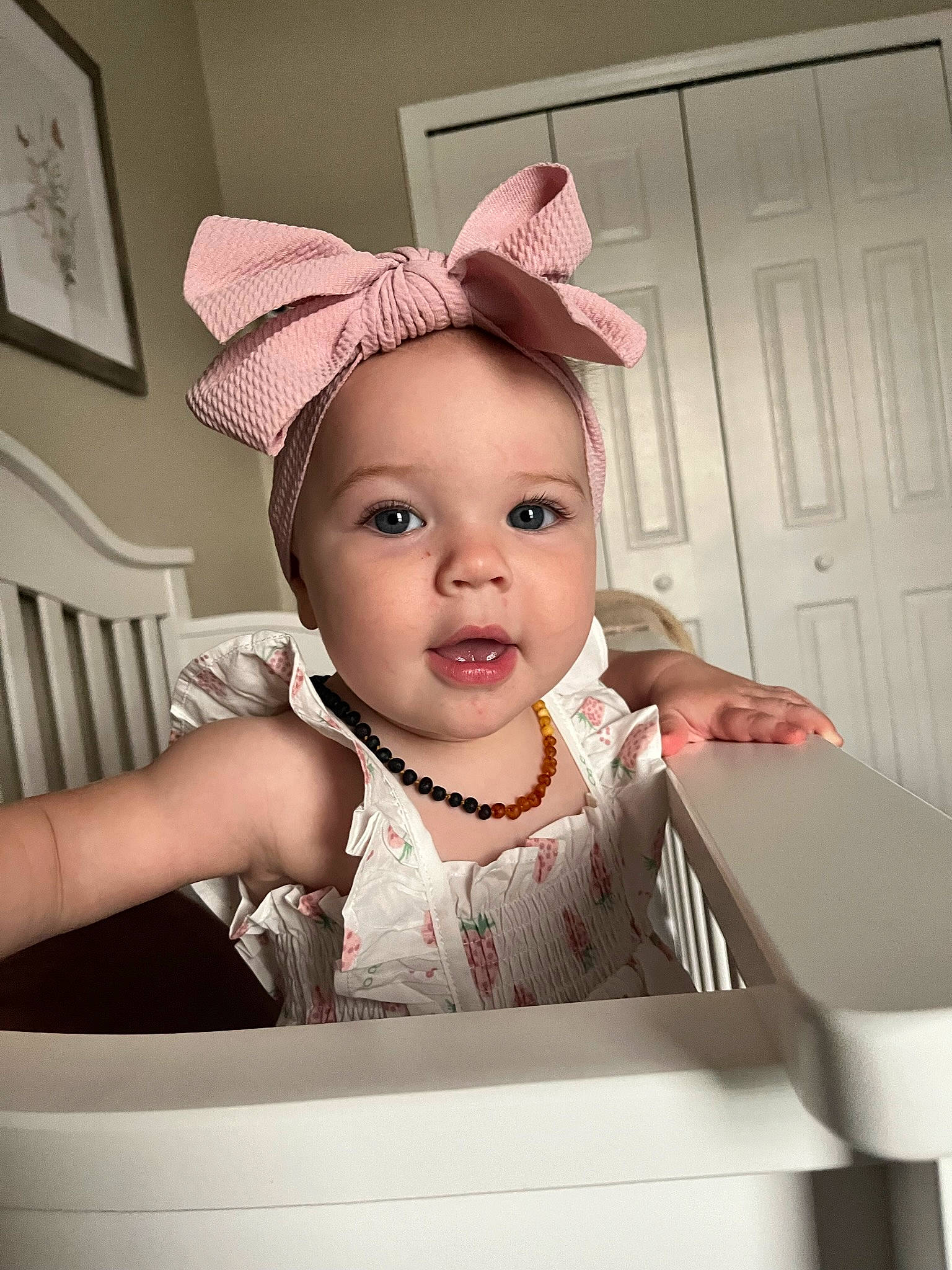 Palmer is registered to the contest to win money with this photo: baby, baby_toddler_clothing, cap, child, costume_hat, door, ear, eyelash, fashion_accessory, fun, happy, lip, person, picture_frame, portrait_photography, room, sitting, sleeve, sweetness, t_shirt