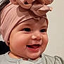 Avleen is registered to the contest to win money with this photo: baby, smiling, headband, flower, face, infant, cute, happy, clothing, heart_pattern, portrait, child, closeup, indoors, young, apparel, headwear, cheerful, baby_girl, adorable