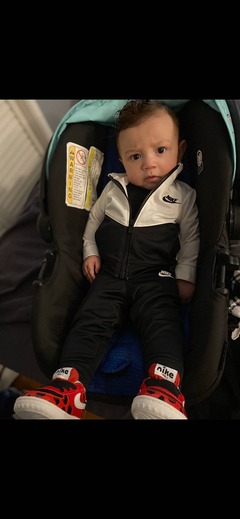 Dj joined the competition — help win amazing prizes! baby, baby_carriage, baby_in_car_seat, baby_products, car_seat, car_seat_cover, carmine, child, comfort, face, fun, head, human_leg, knee, lap, person, seat_belt, sitting, sock, toddler